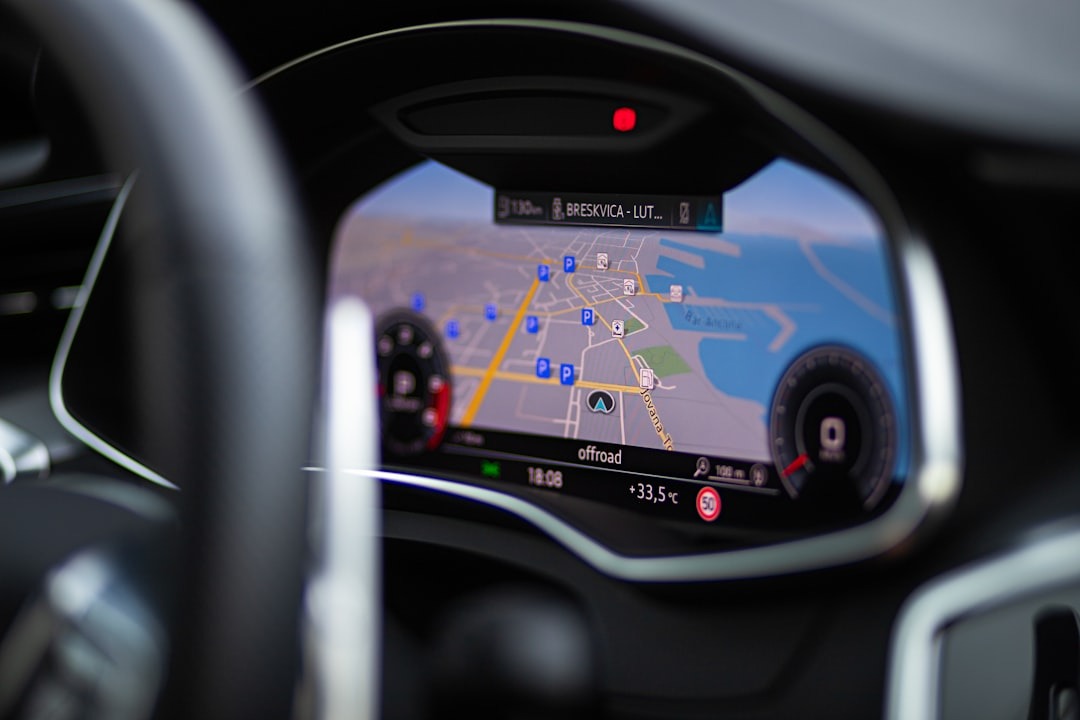 Car digital dashboard displays a navigation map and driving metrics.